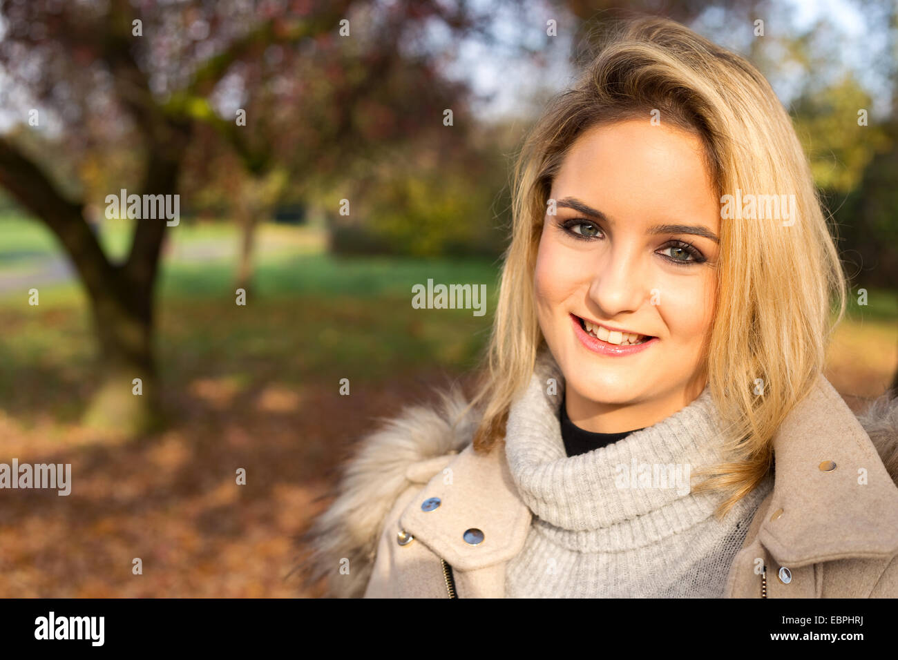 beautiful blonde in a park. Stock Photo