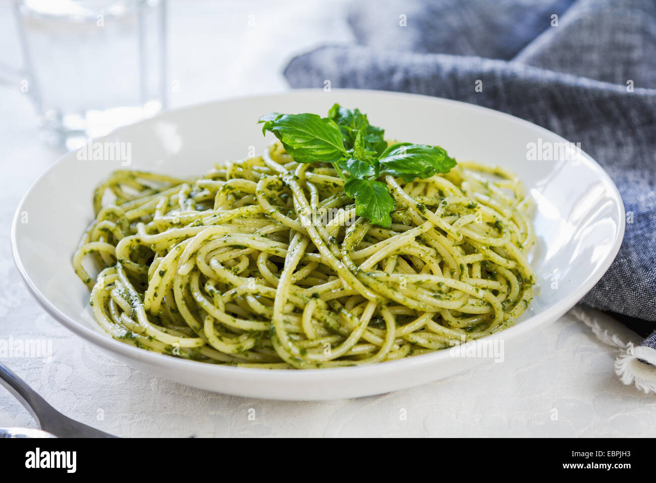 Spaghetti with homemade pesto sauce Stock Photo