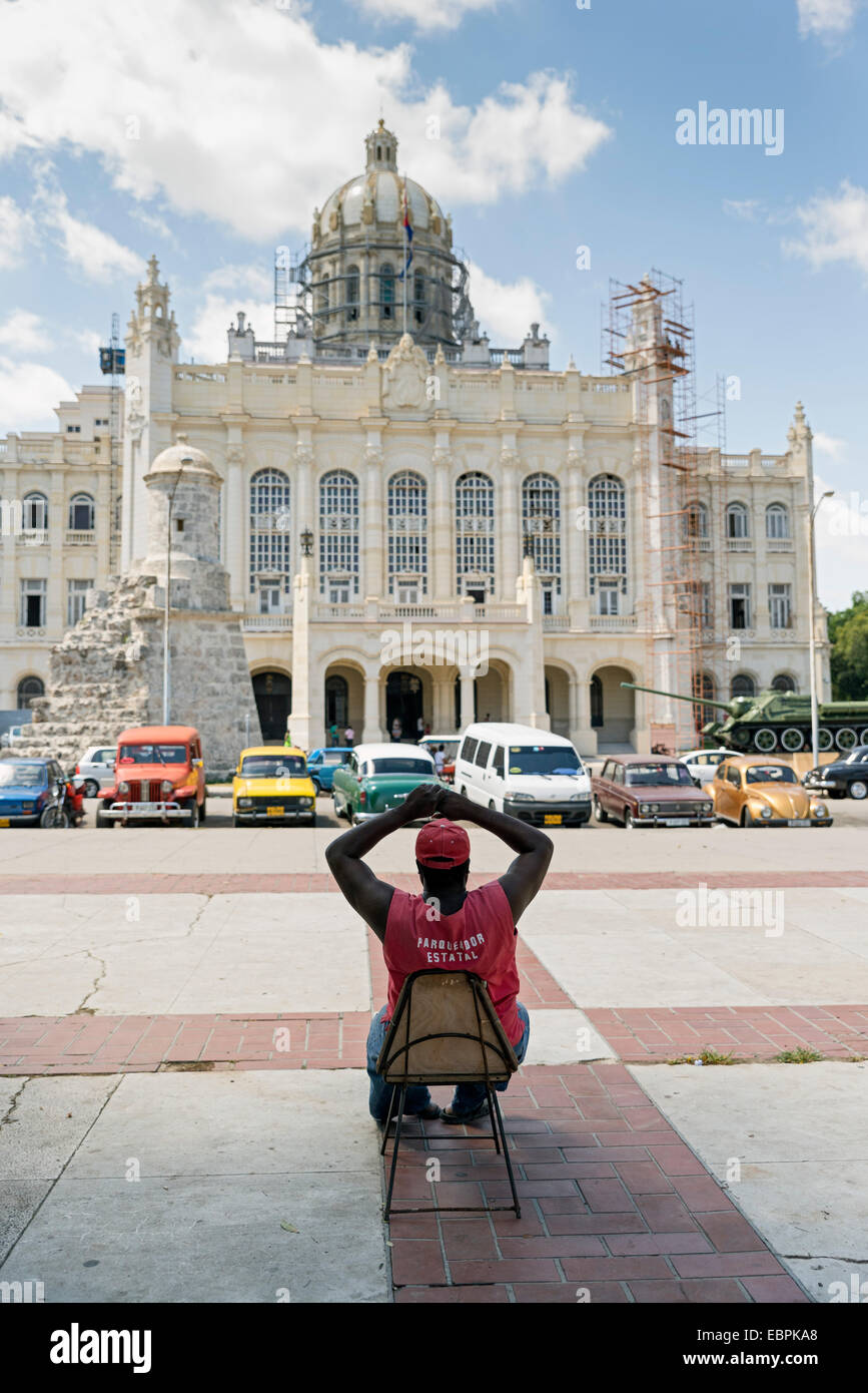 HAVANA - MAY 5: A parking attendant in front of the Museum of the Revolution on May 5, 2014 in Havana, Cuba Stock Photo