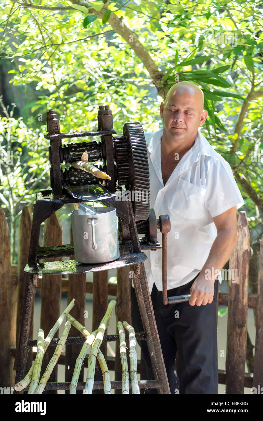 CUBA - MAY 5, 2014: Manual mechanism for making juice from sugarcane in Cuba Stock Photo