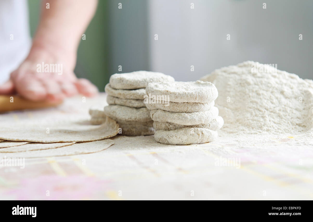 Woman with a rolling for Karelian pies Stock Photo