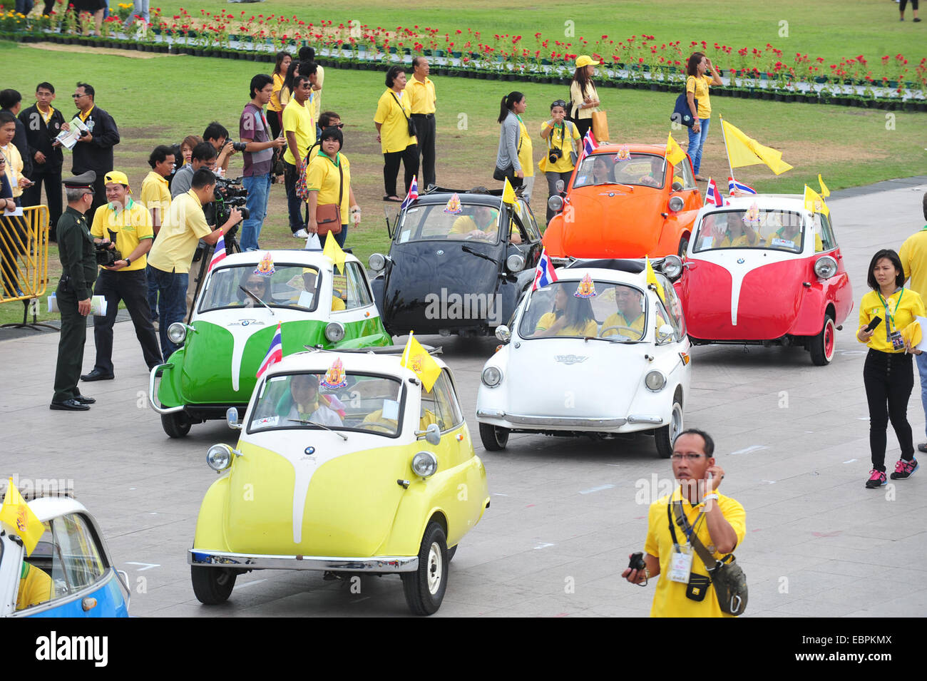 Bangkok, Thailand. 4th Dec, 2014. Antique cars are seen during a parade as part of the celebration of Thai King's 87th Birthday Anniversary in front of Grand Palace in Bangkok, Thailand, Dec. 4, 2014. Thai King Bhumibol Adulyadej will celebrate his 87th birthday on Dec. 5. Credit:  Rachen Sageamsak/Xinhua/Alamy Live News Stock Photo