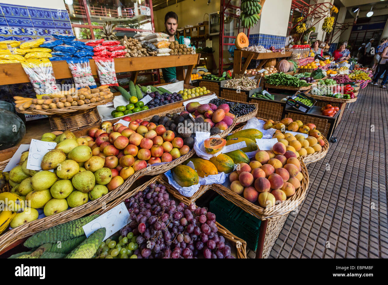 Vendors inside the Funchal Market, where fresh produce and fish are sold in Funchal, Madeira, Portugal, Europe Stock Photo