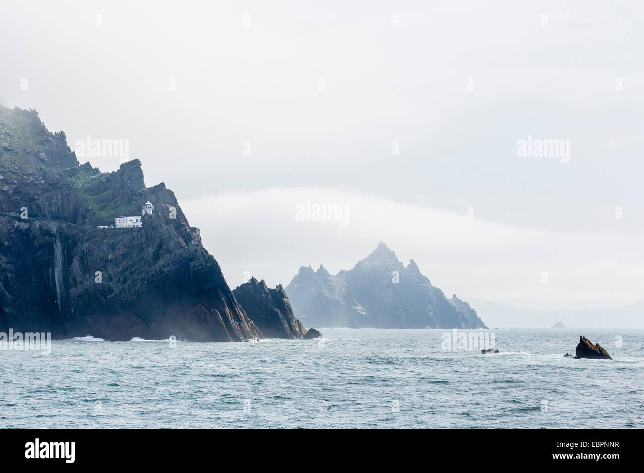 Fog shrouds the Skellig Islands, Great Skellig Michael in the foreground, County Kerry, Munster, Irish Sea, Republic of Ireland Stock Photo