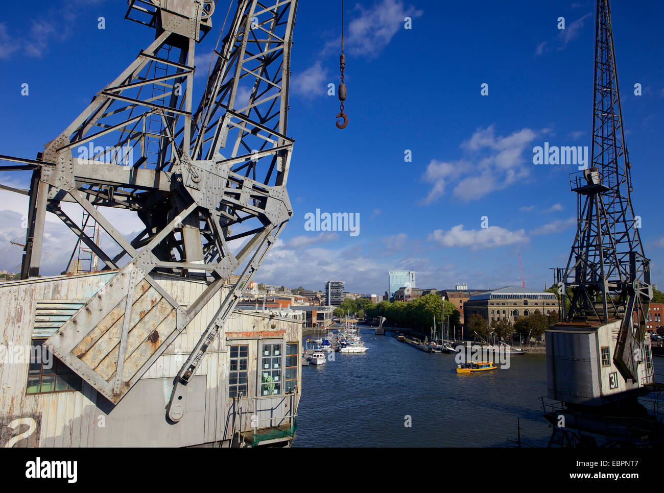 Bristol's floating harbour and an old Dockside crane, Bristol, England, United Kingdom, Europe Stock Photo