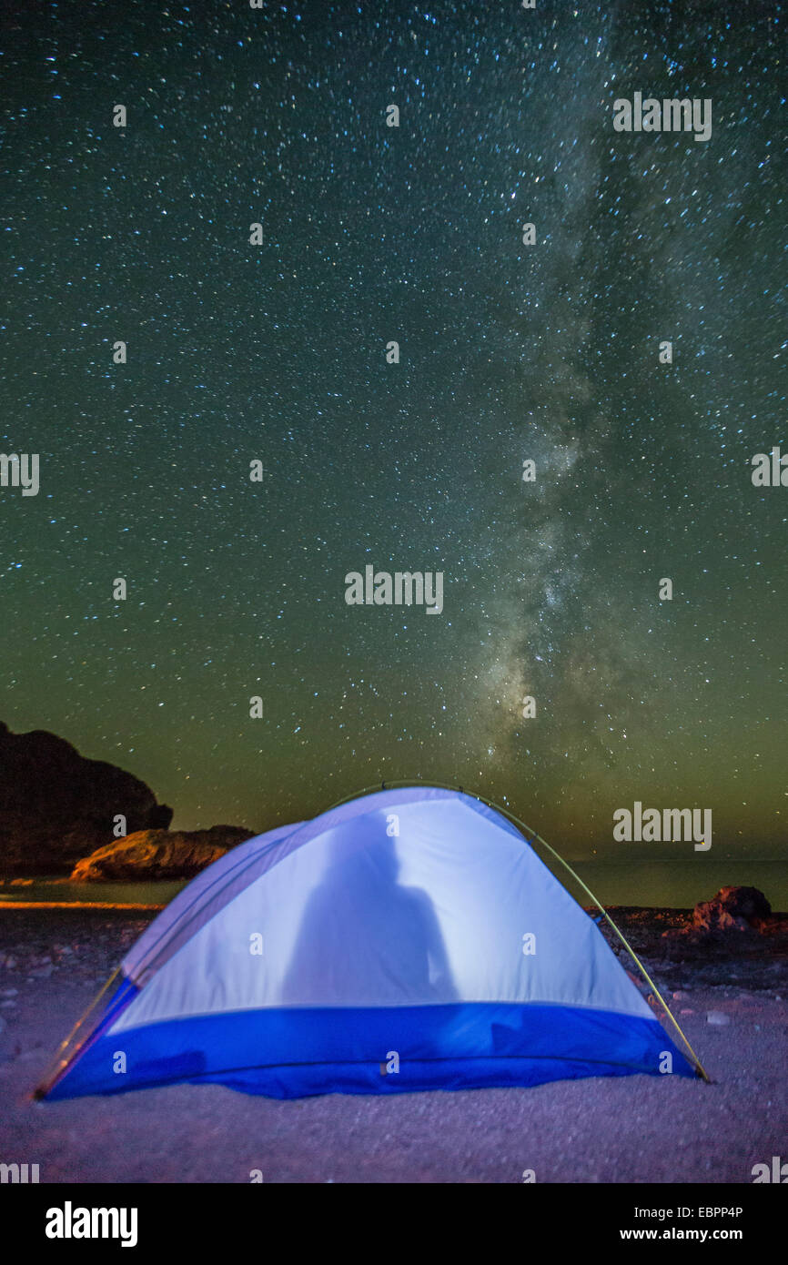Night view of the Milky Way with lit up tent in foreground, Himalaya Beach, Sonora, Mexico, North America Stock Photo
