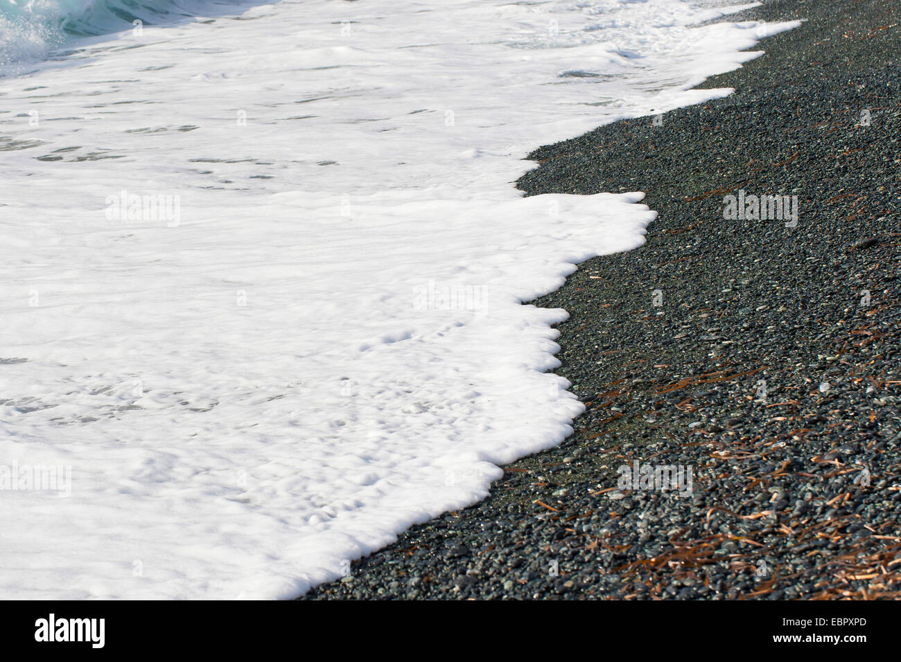 waves at a pebble beach, France, Corsica Stock Photo