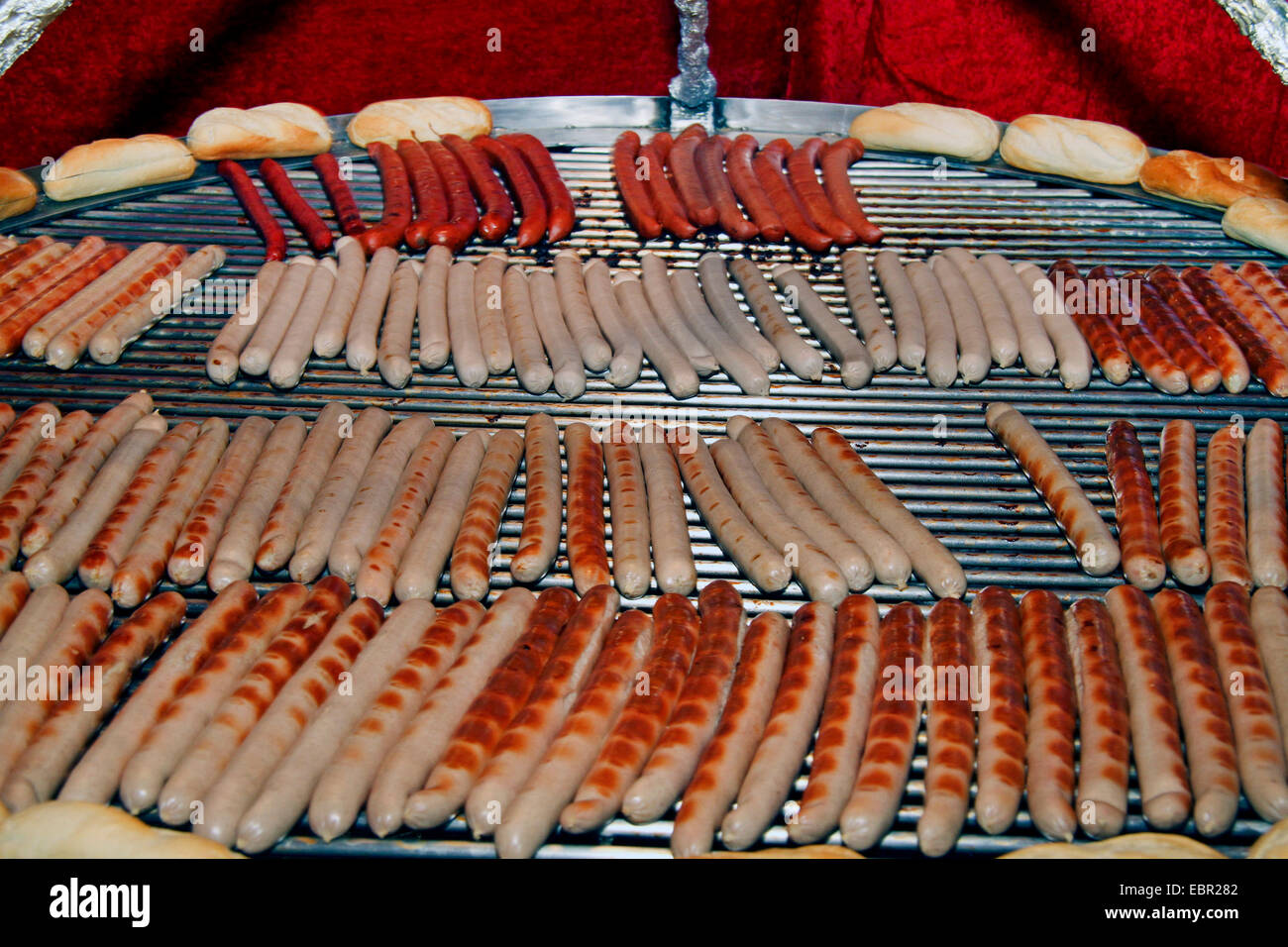 barbecue sausages on swivel grill, Germany Stock Photo