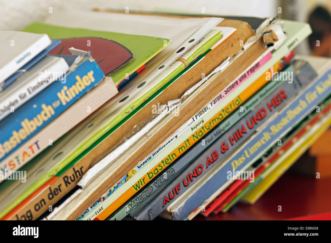 well-thumbed children's books in a shelf, Germany Stock Photo