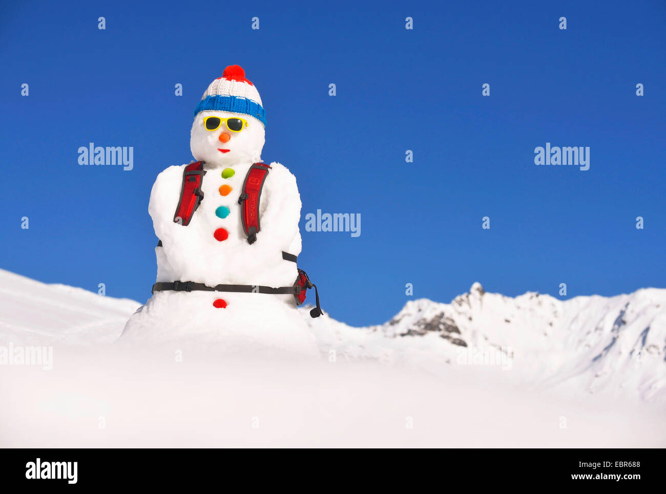 snowman with woolly hat in the French national colours and backpack, France Stock Photo