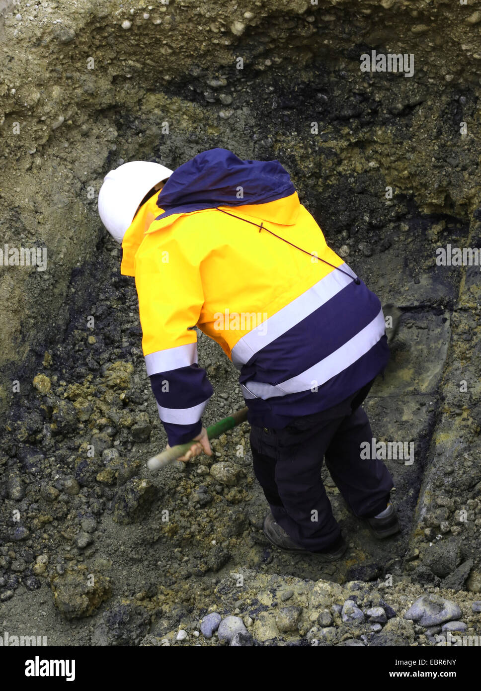 worker during roadwords underground with jacket Stock Photo