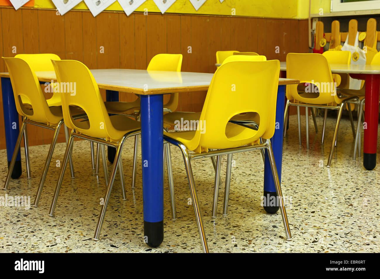 classroom of a school for children with the little yellow chairs Stock Photo