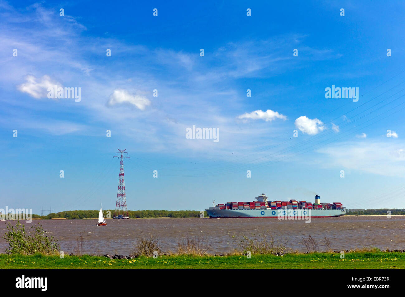 containership on the Elbe in the Altes Land, Germany, Lower Saxony Stock Photo