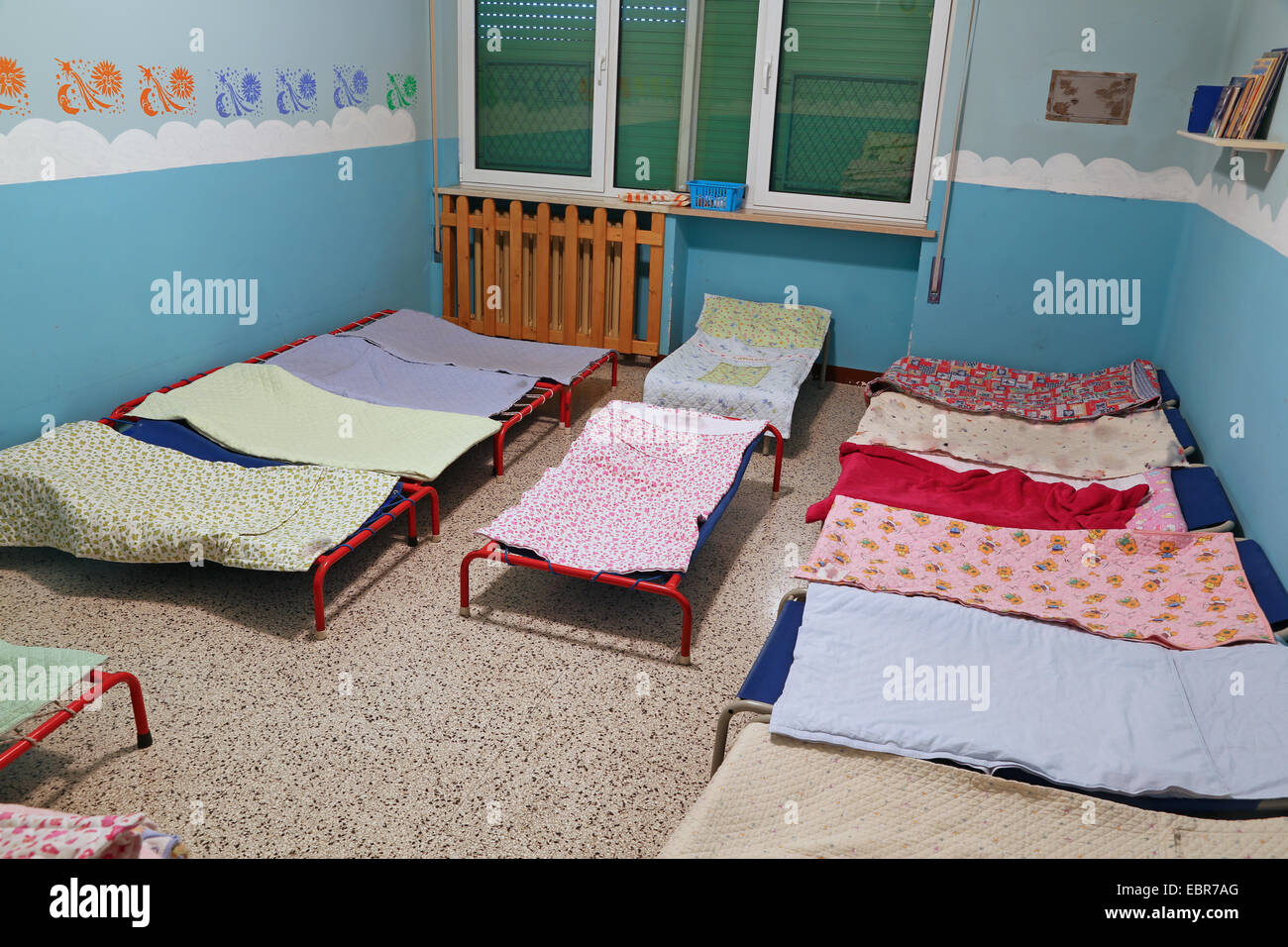 dormitory with small beds for children in the early childhood school Stock Photo