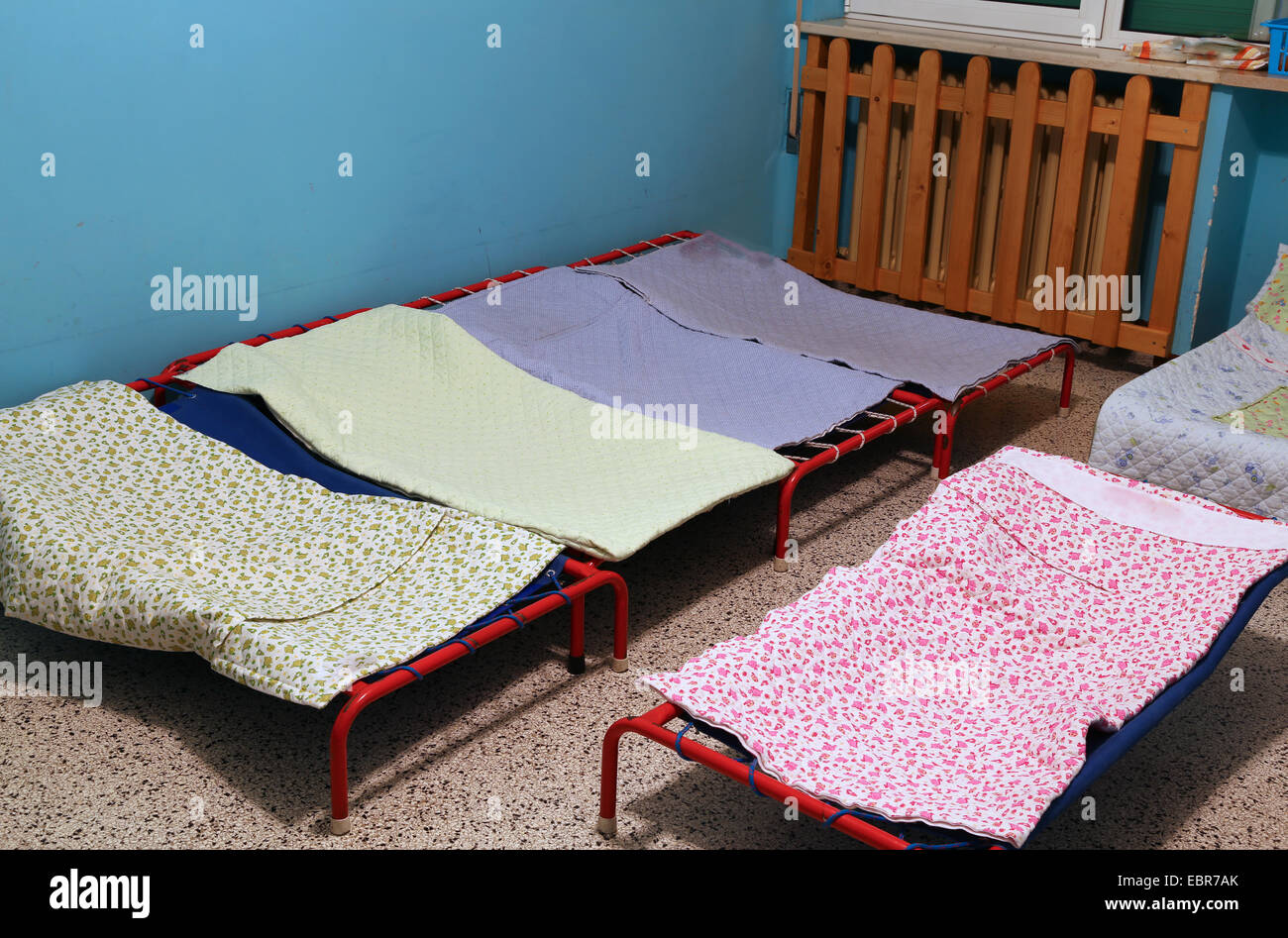 dormitory with little beds for children in the early childhood school Stock Photo