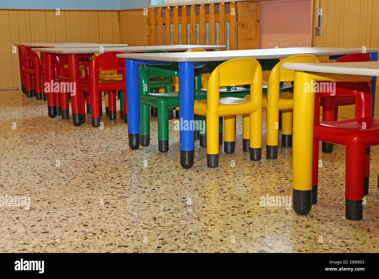 small colored chairs and tables of a refectory in kindergarten Stock Photo