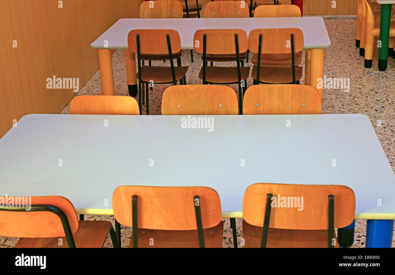 ordered chairs and tables of a refectory in kindergarten Stock Photo