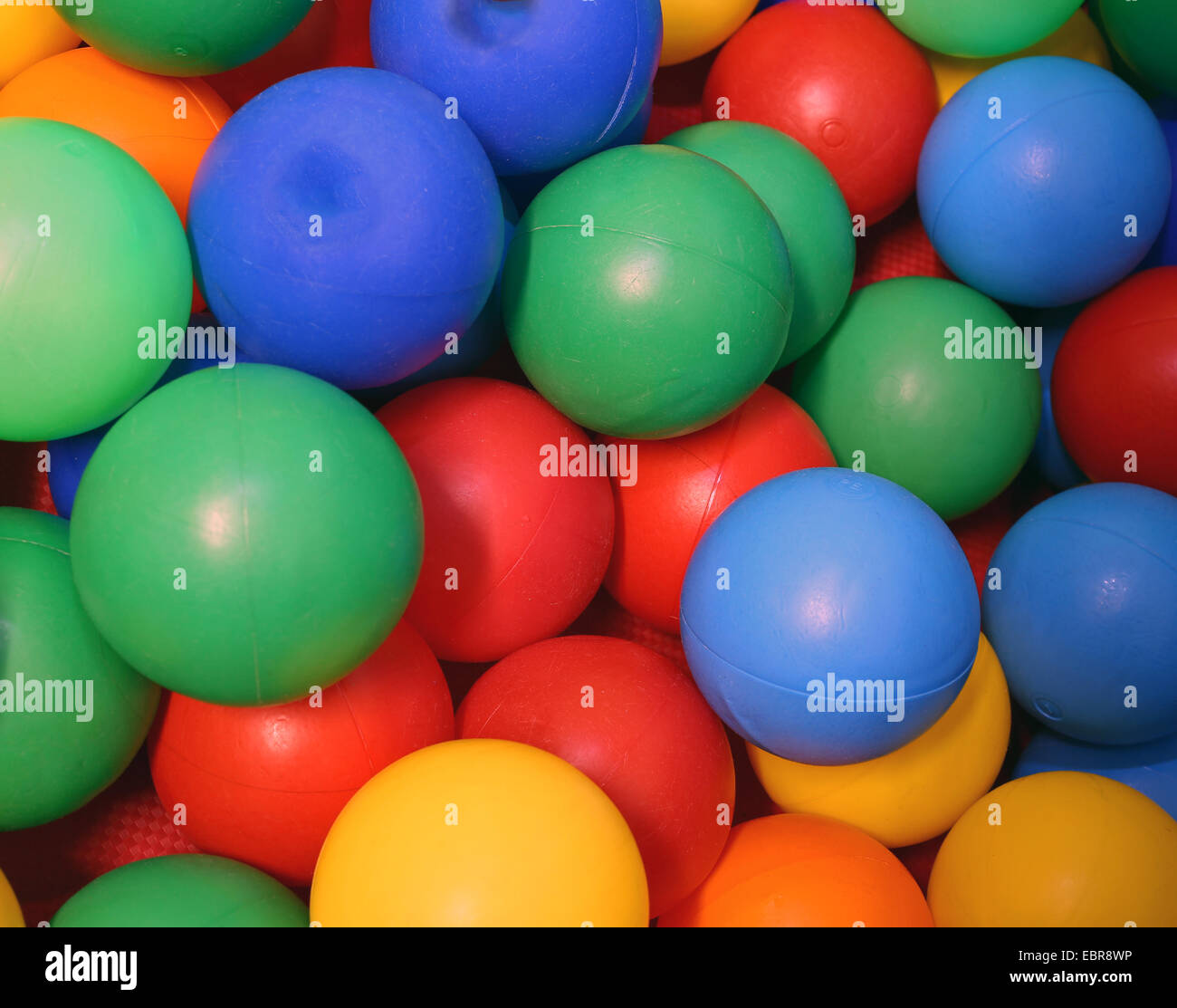 plastic colored balls with vivid colors into a pool of balls Stock