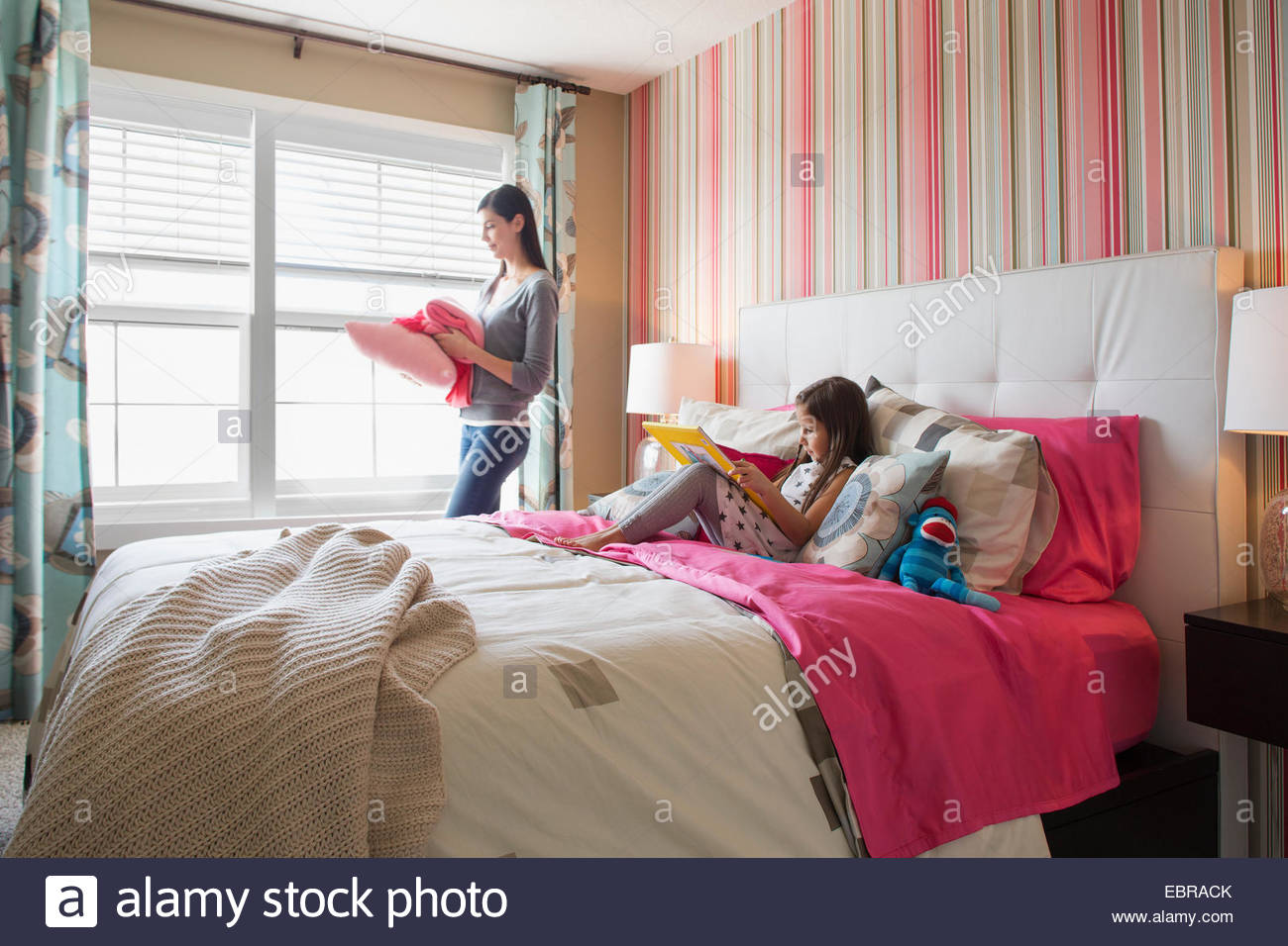 Mother and daughter in bedroom Stock Photo