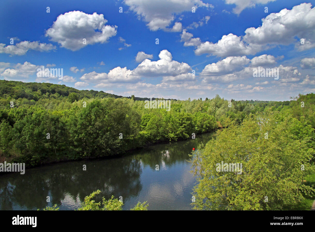 Heinsing Ruhr river banks and cumulus clouds, Germany, North Rhine-Westphalia, Ruhr Area, Essen Stock Photo
