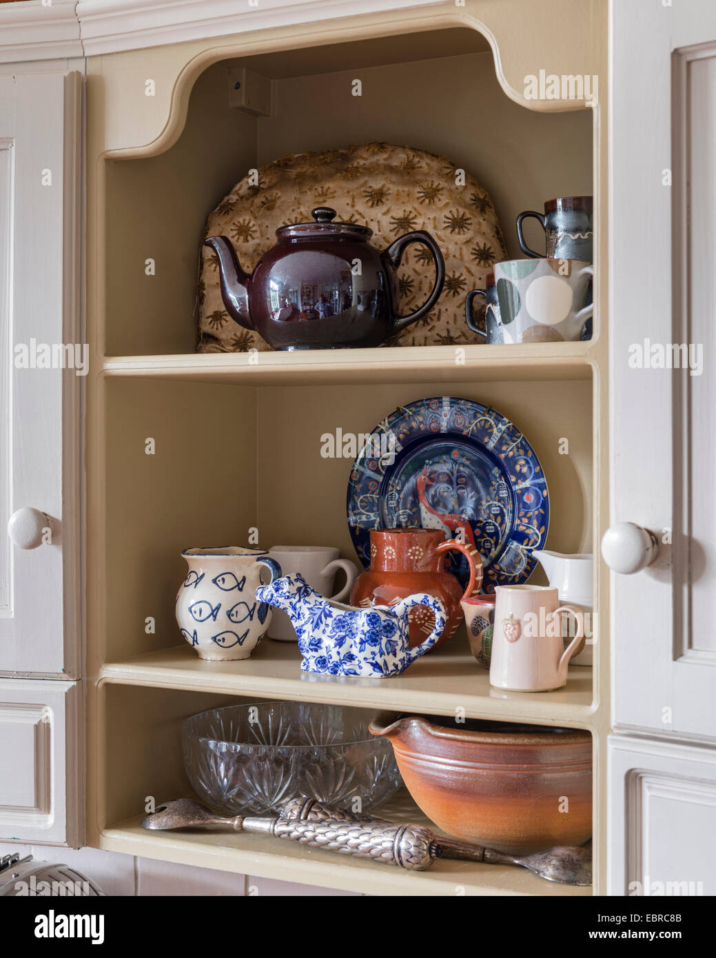 Kitchen and chinaware on recessed shelf Stock Photo Alamy