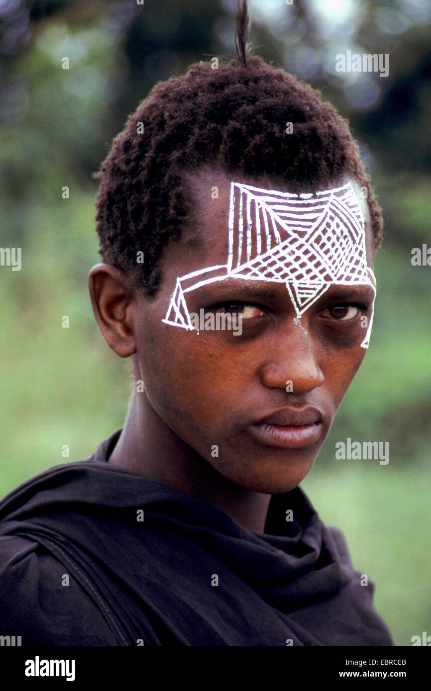 portrait of a young woman with traditional face painting, Tanzania Stock Photo