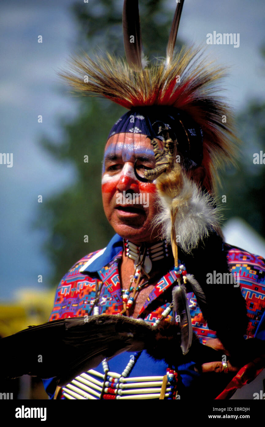 mohican with typical headdress of feathers and face painting at the pow
