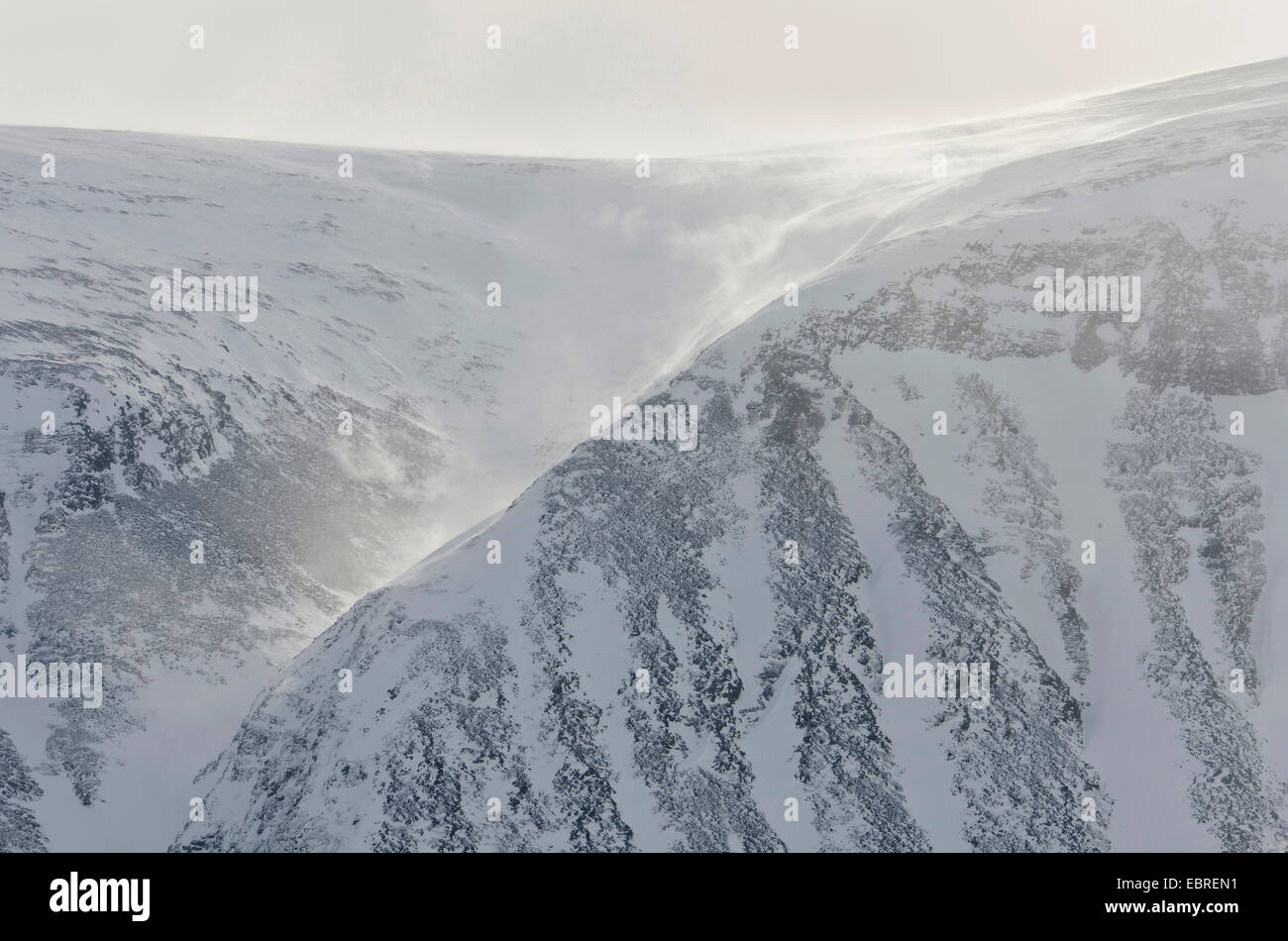 view to Vistasdalen valley, snow drifts at mountain slopes, Sweden, Lapland, Norrbotten, Kebnekaisefjaell Stock Photo
