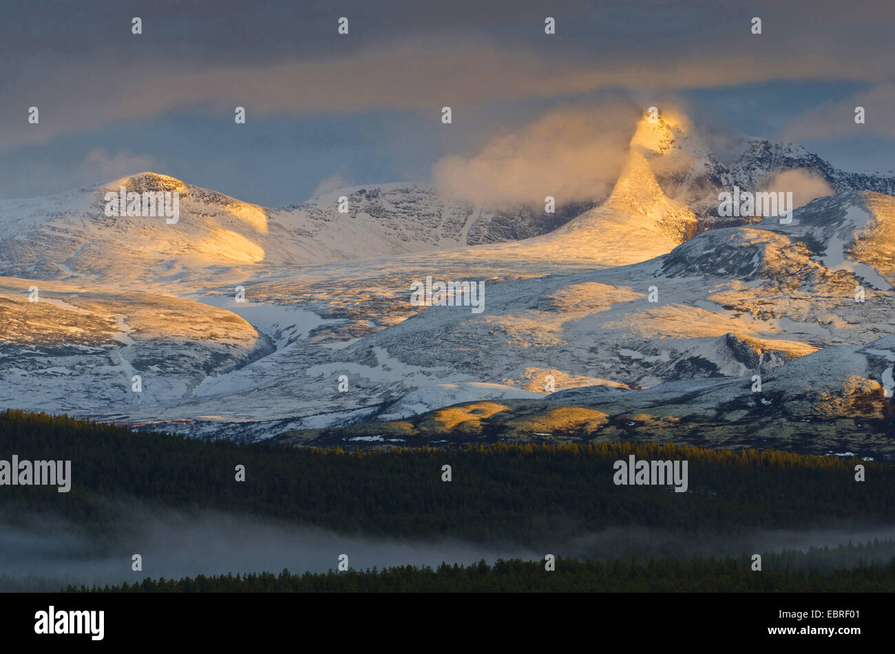 clouds at Hoegronden mountain in evening light, Norway, Hedmark Fylke, Rondane National Park Stock Photo