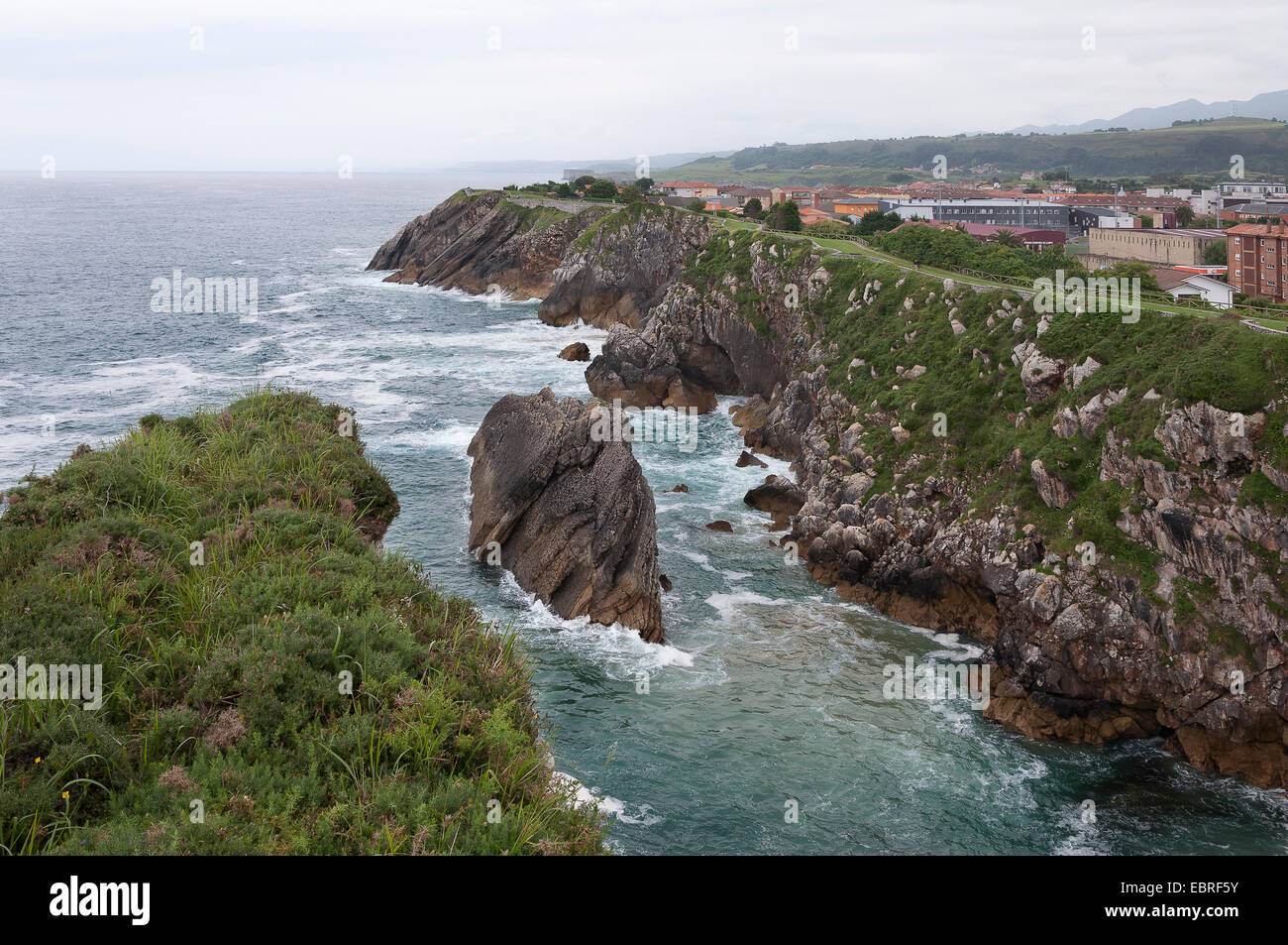 Rocky shoreline of the town of Llanes - Asturias, Spain Stock Photo