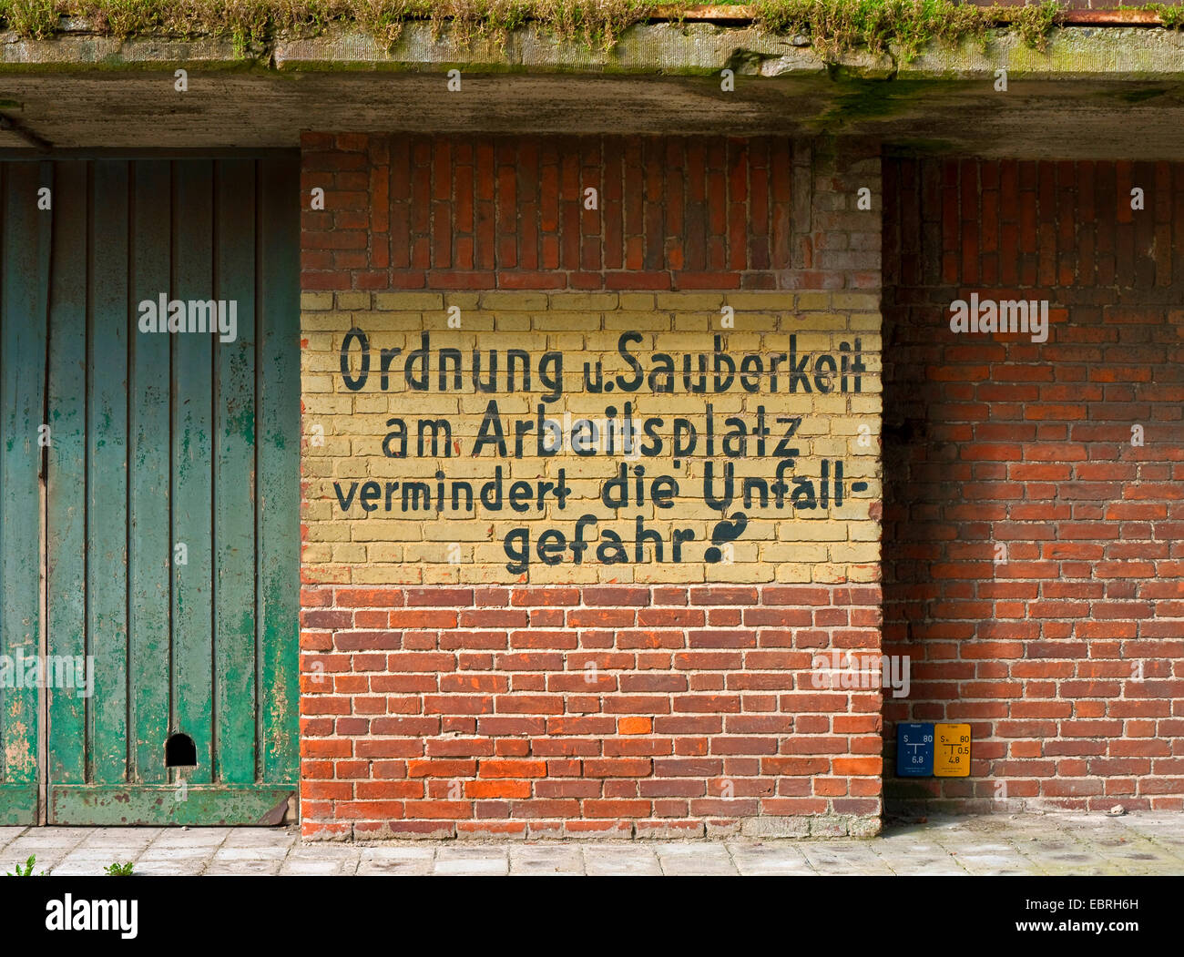 appeal for order and cleanness at the workplace at the facade of an old silo, Germany Stock Photo