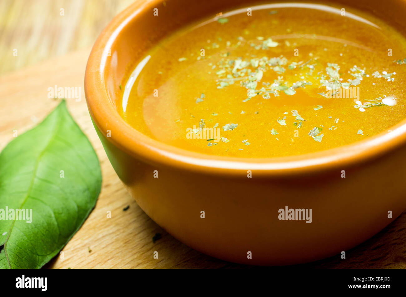 Broth, bouillon, clear soup in a clay pot, closeup Stock Photo Alamy