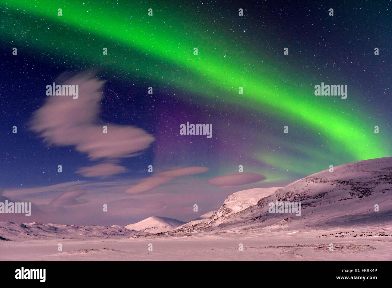 Aurora borealis over mountains at Weitwa in moonlight, Sweden, Lapland Stock Photo