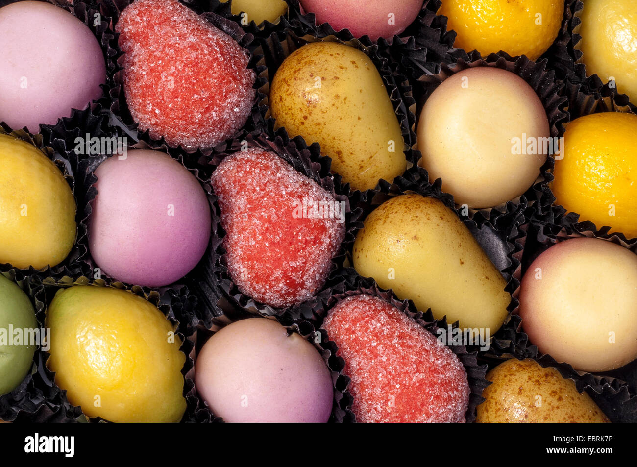 Sugary Marzipan Fruit Candy in Selection Tray with Wrappers Stock Photo