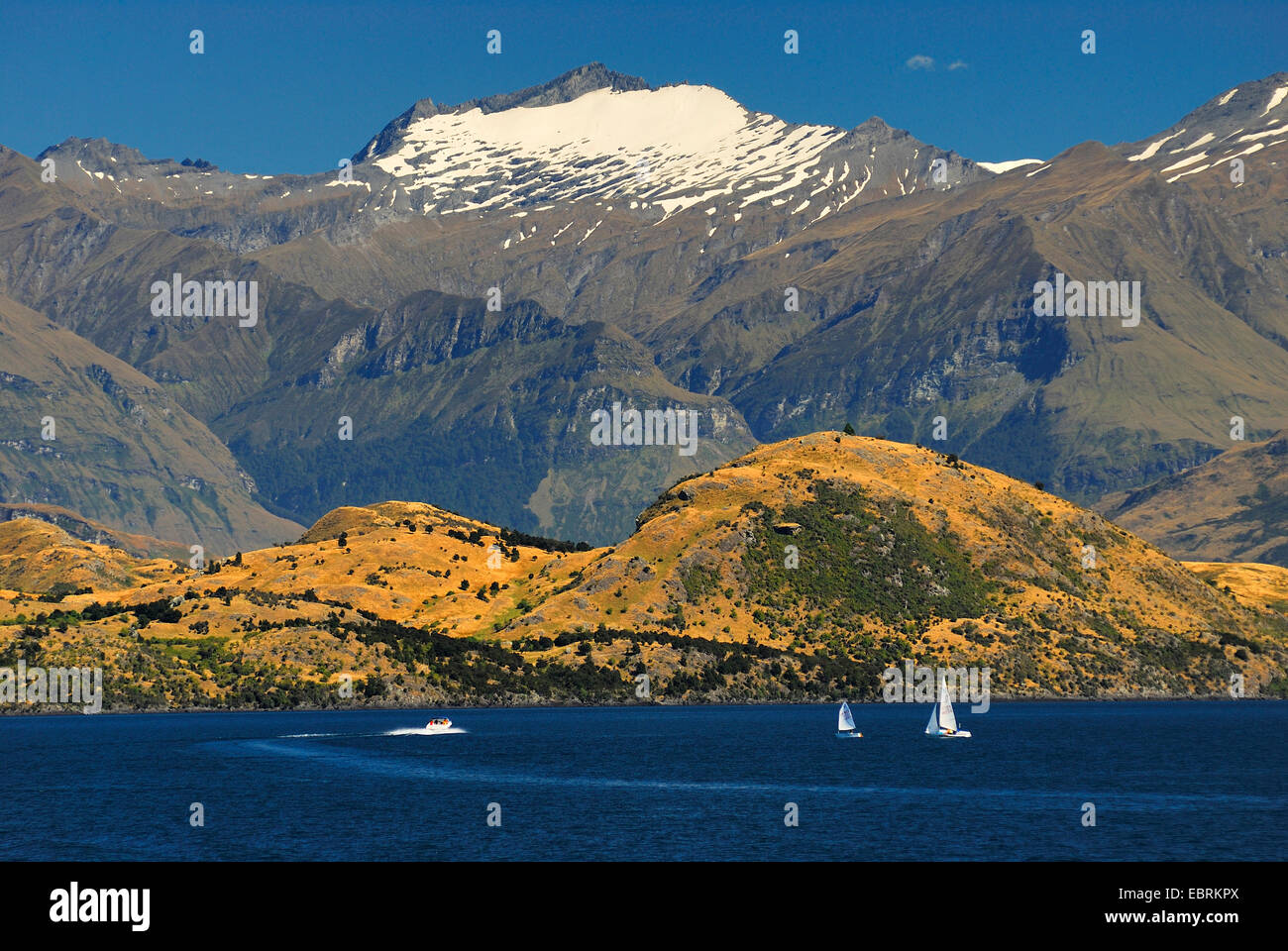 panoramic view over Lake Wanaka with mountains of the Southern Alps looming in the background, New Zealand, Southern Island, Otago Stock Photo