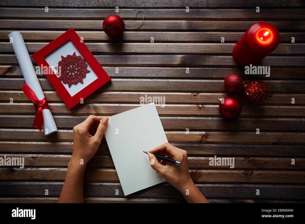 Female hands writing something on sheet of paper Stock Photo - Alamy
