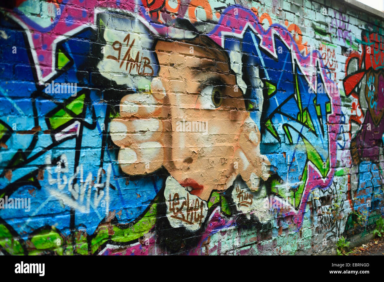 face looking through a hole, graffiti , Germany, Bavaria Stock Photo