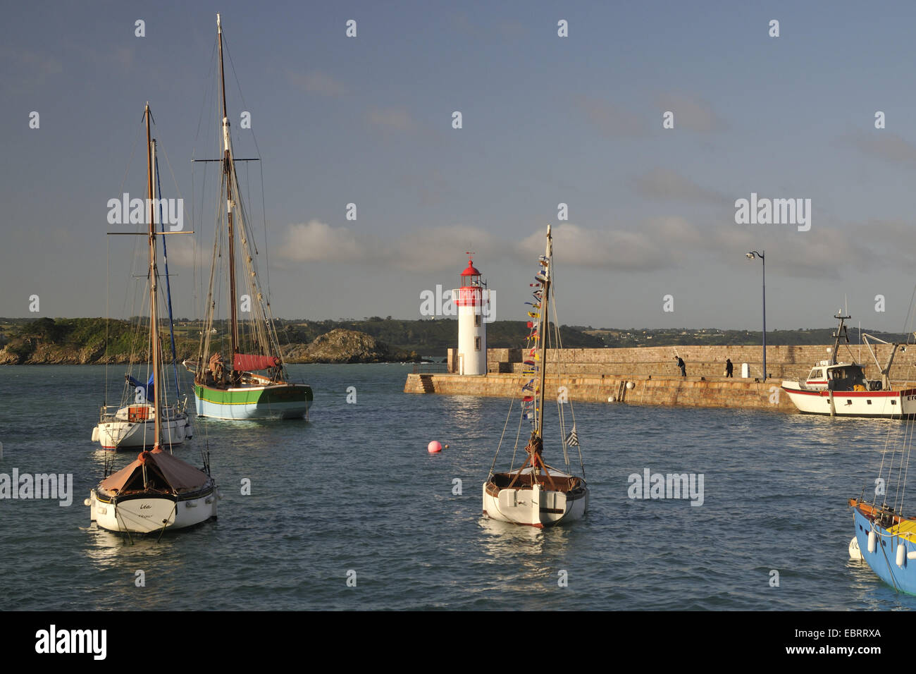 harbor and lighthouse of Erquy at high tide, France, Brittany, Erquy Stock Photo