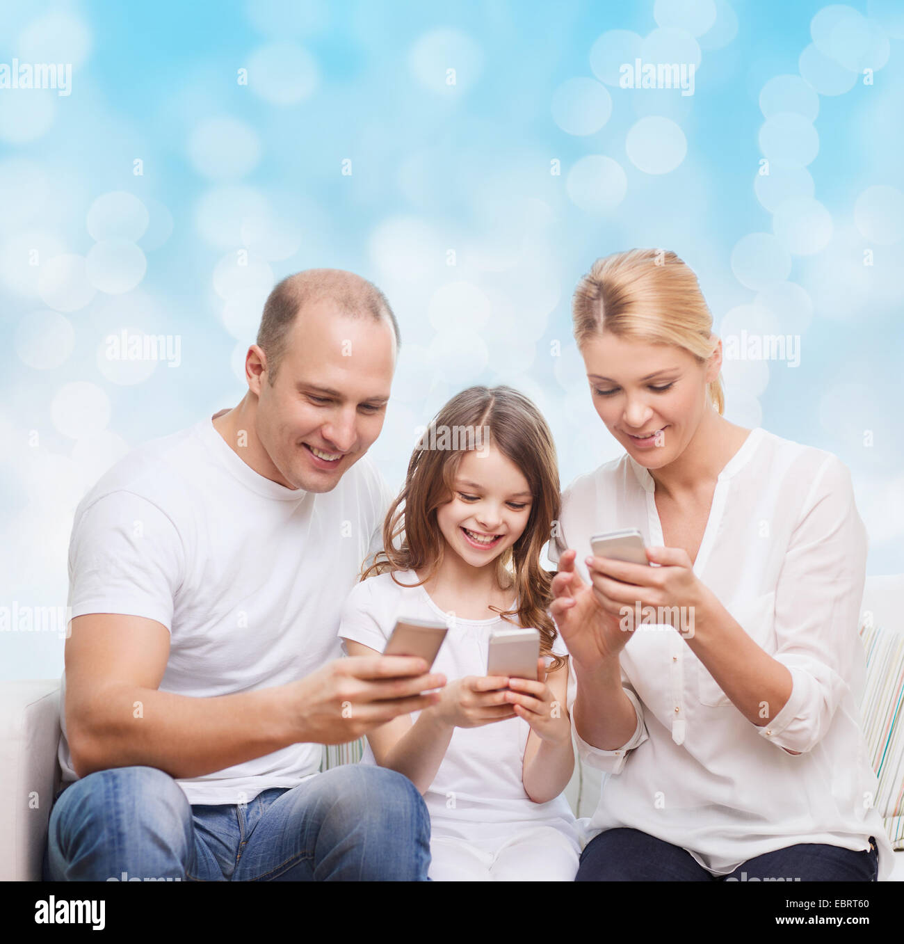 happy family with smartphones Stock Photo - Alamy