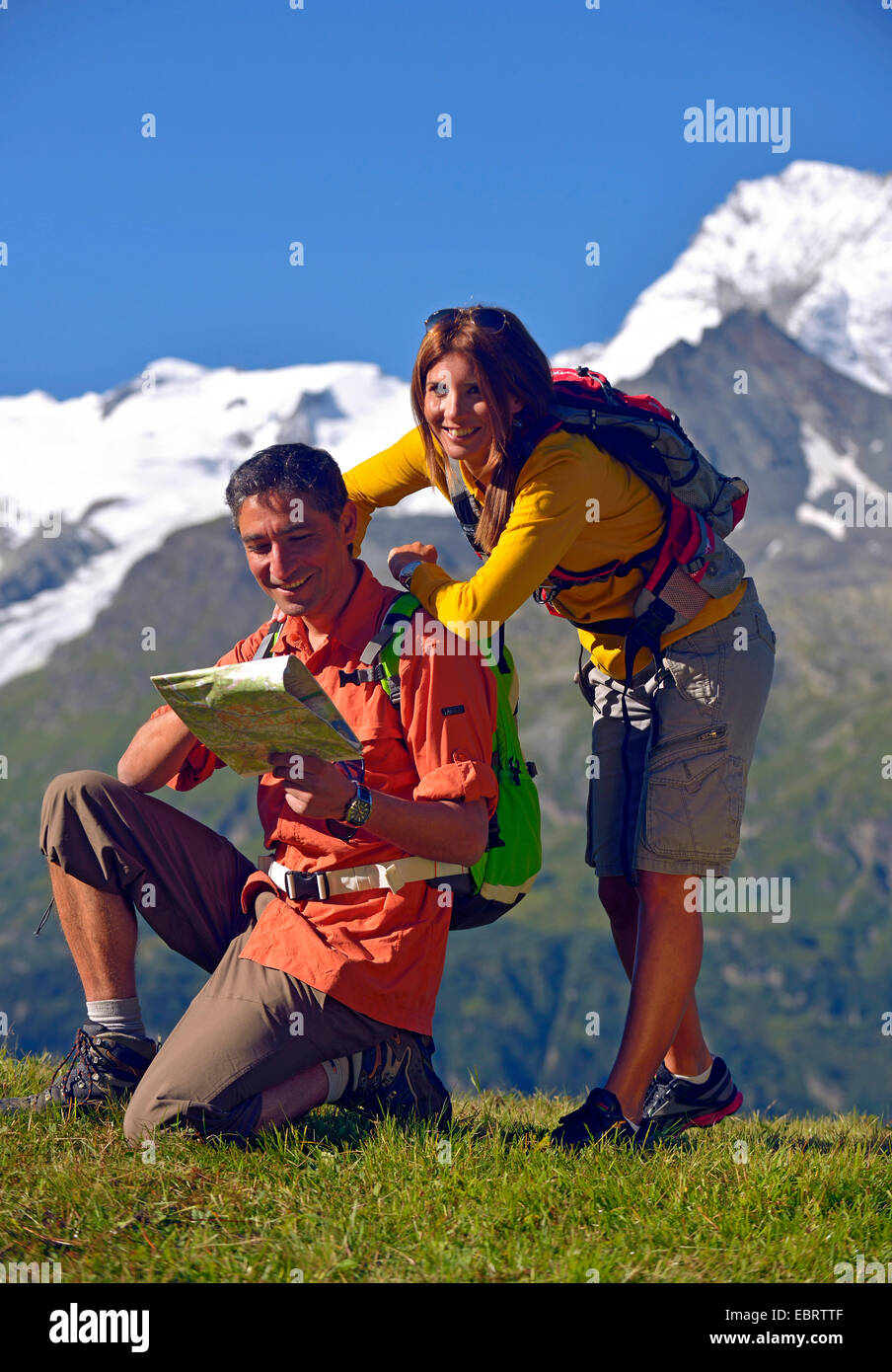 couple trekking in the mountains of Sainte-Foy-Tarentaise, France, Savoie Stock Photo