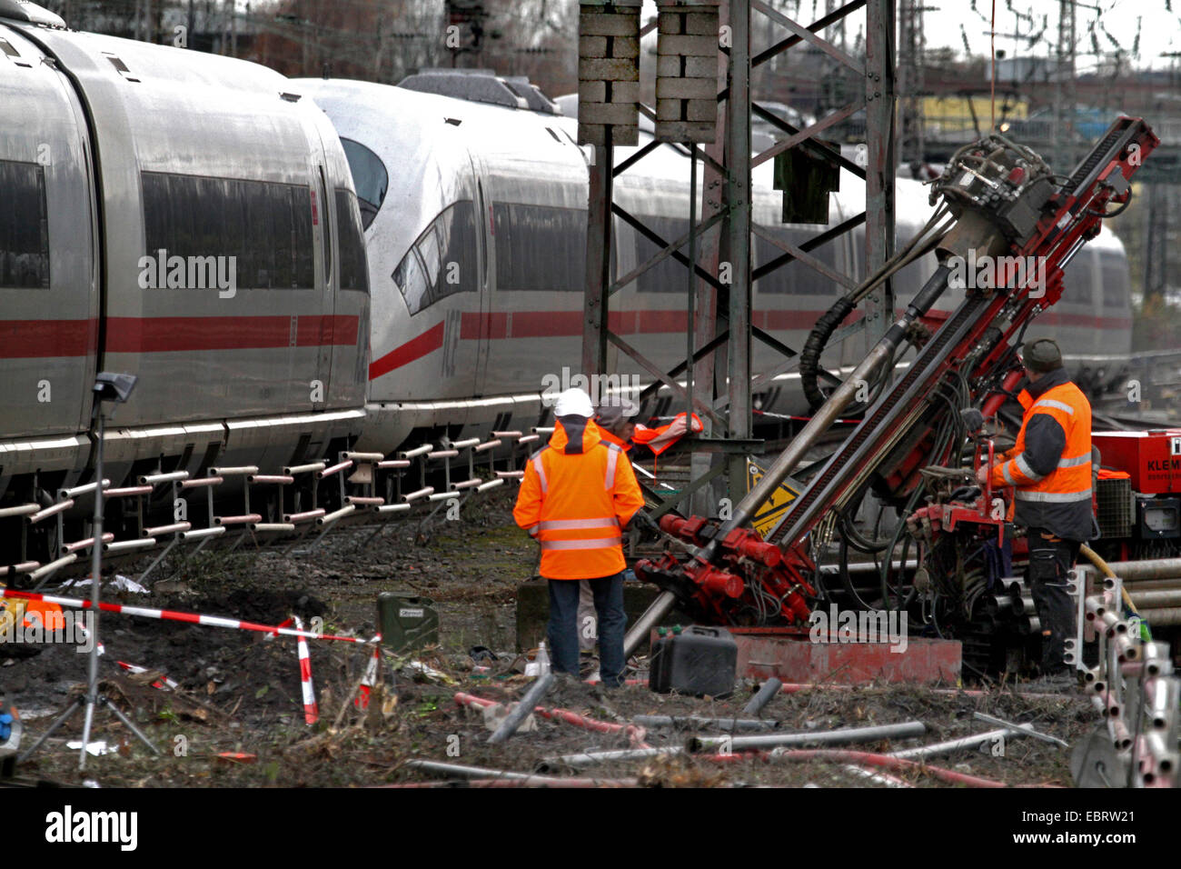 railroad workers during test drillings in the roadbed at 30th Nov. 2013 to figure out if there are further former coal adits in the area of the main railway station, Germany, North Rhine-Westphalia, Ruhr Area, Essen Stock Photo