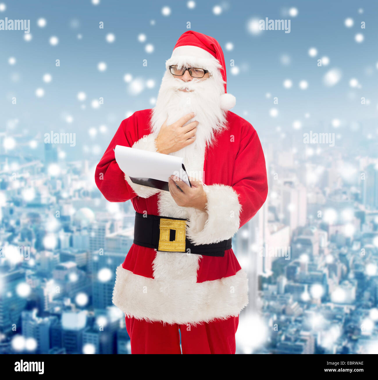 man in costume of santa claus with notepad Stock Photo - Alamy