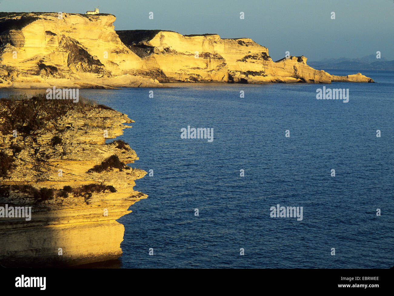 lighthouse on the rock called the Sugar and Capo Pertusato seen from Bonifacio, France, Corsica, Bonifacio Stock Photo