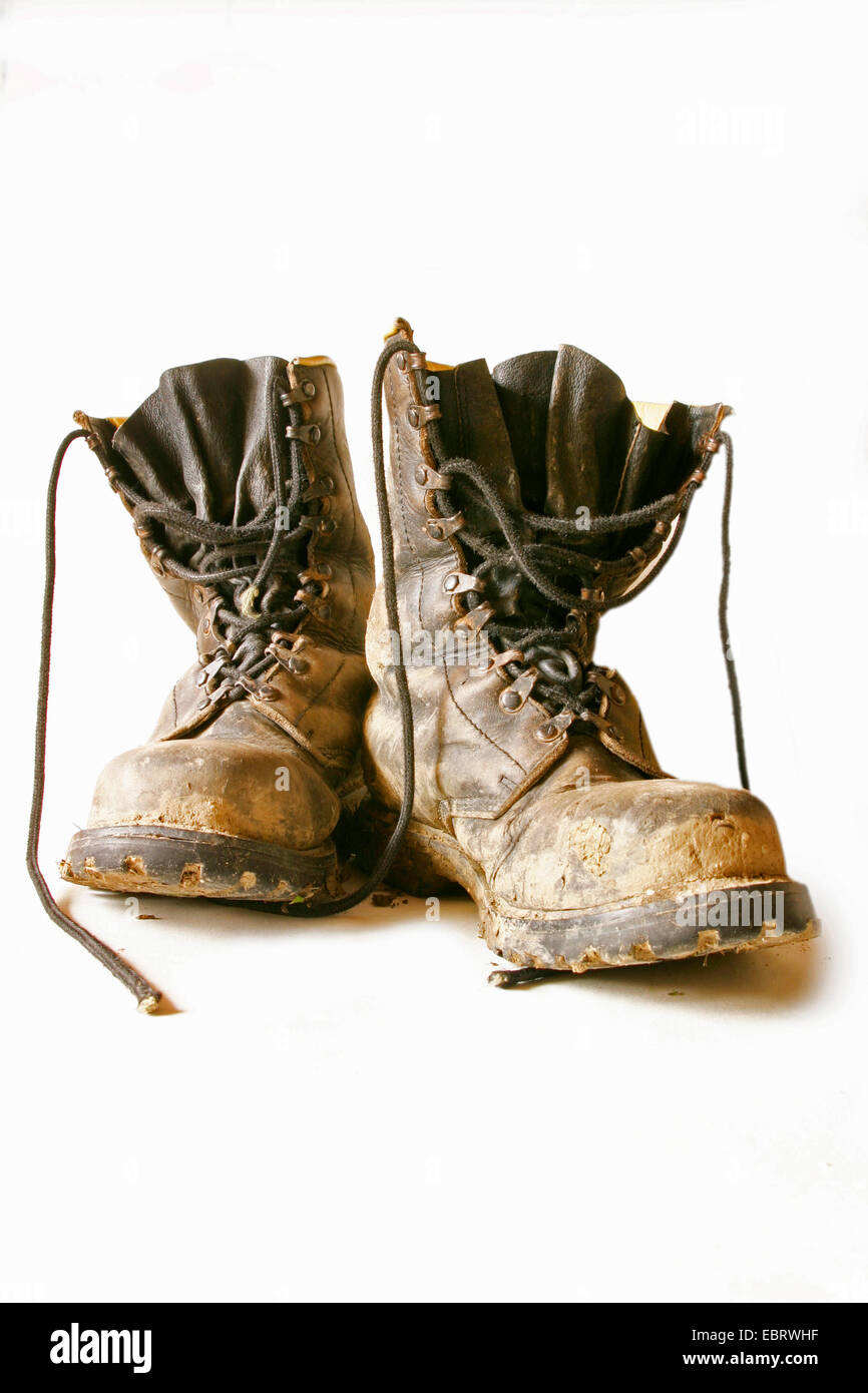 a pair of loamy old leather boots Stock Photo
