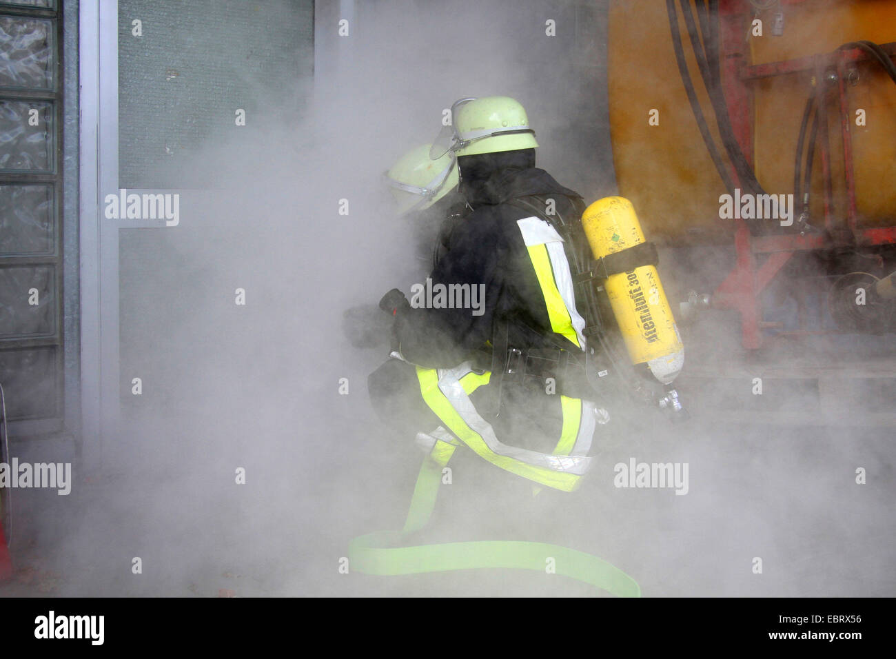 firefighting exercise with protective respiratory equipment, Germany Stock Photo