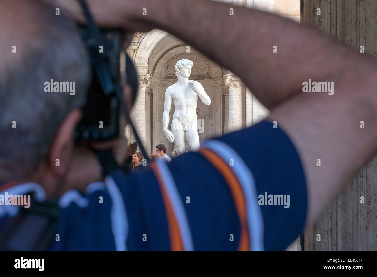 Italy: Man takes picture of a replica of David at the Capitoline Museums, Rome. Photo from 6. September 2014. Stock Photo