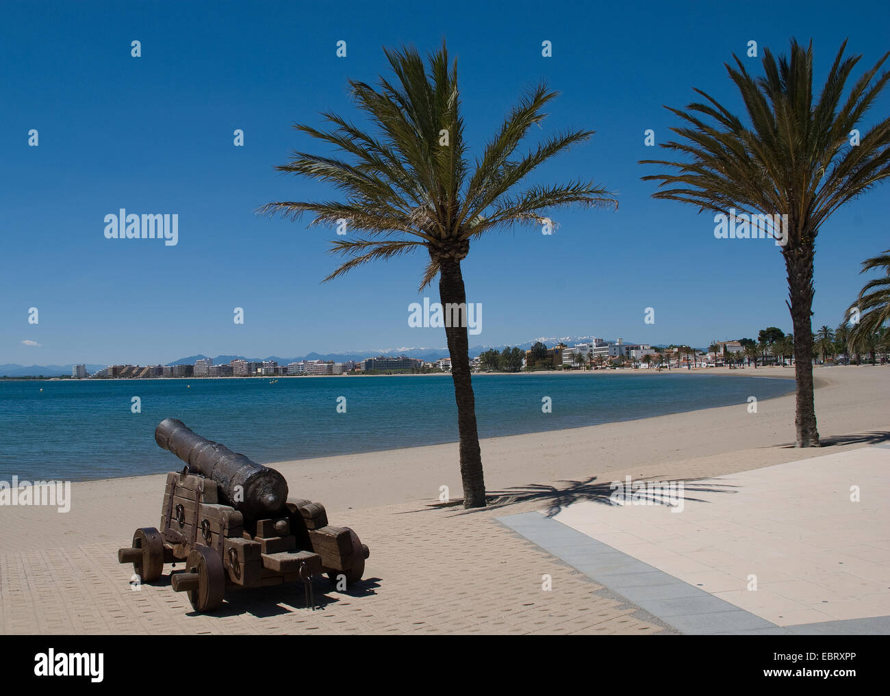 View of Roses on the Catalan coast of Spain with ancient cannon in the ...