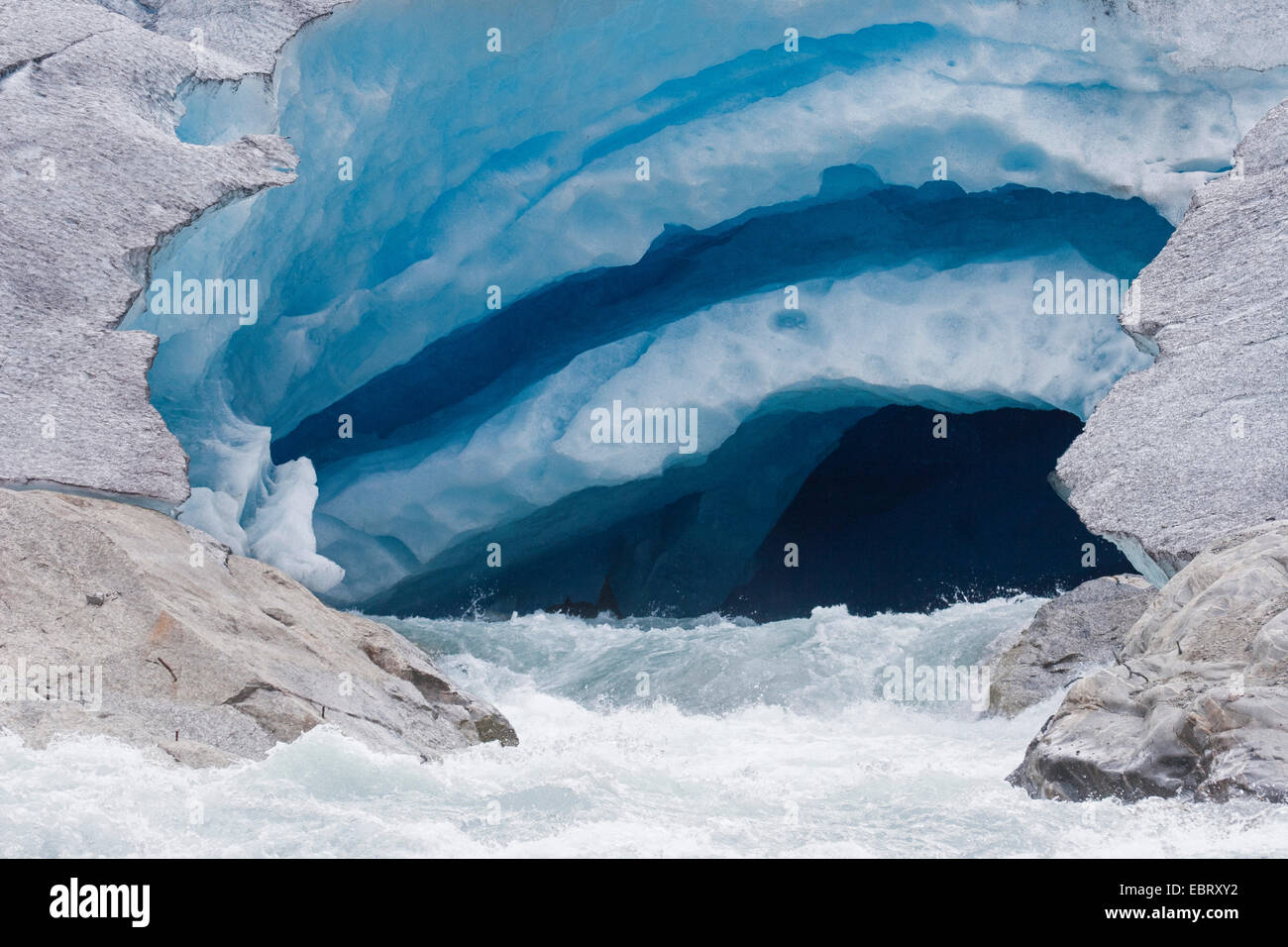 melt water leaking out of glacier snout of Nigardsbreen, a glacier arm of Jostedalsbreen glacier, Norway, Jostedalsbreen National Park Stock Photo