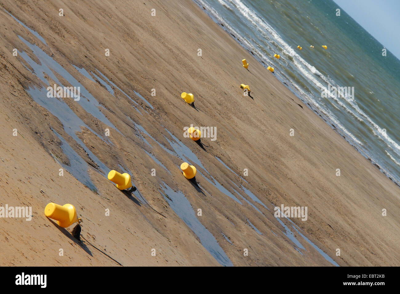 Buoys are laid on the beach of Arromanches (France). Stock Photo