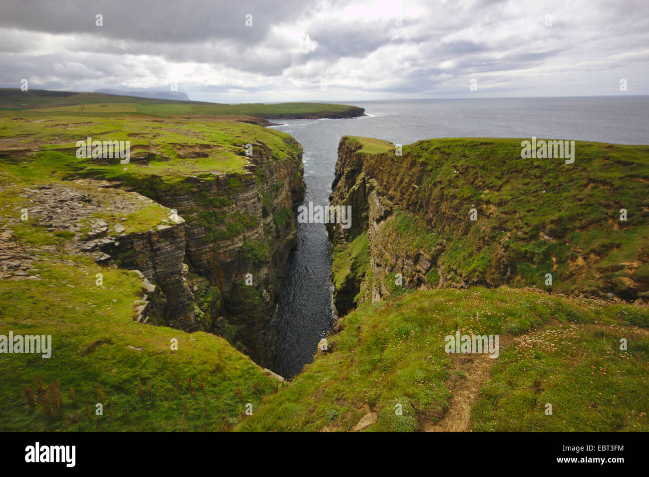 cliff line with ravine like erosion Ramna Geo, United Kingdom, Scotland, Orkney, Orkney Mainland Stock Photo